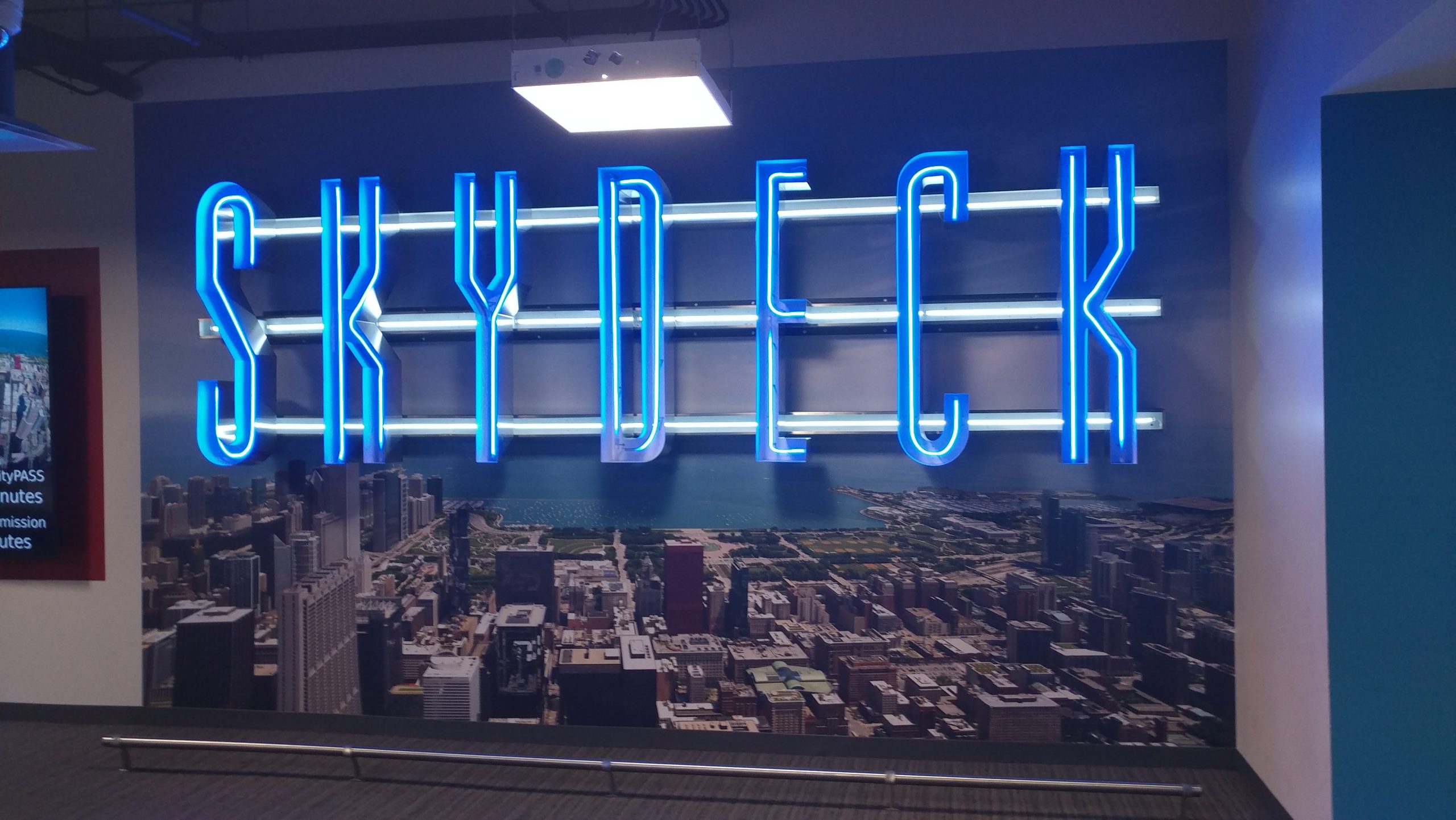 Illuminated signage that says skydeck in blue
