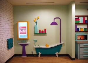 Interactive Area featuring bathroom set up with touch screen display above the sink
