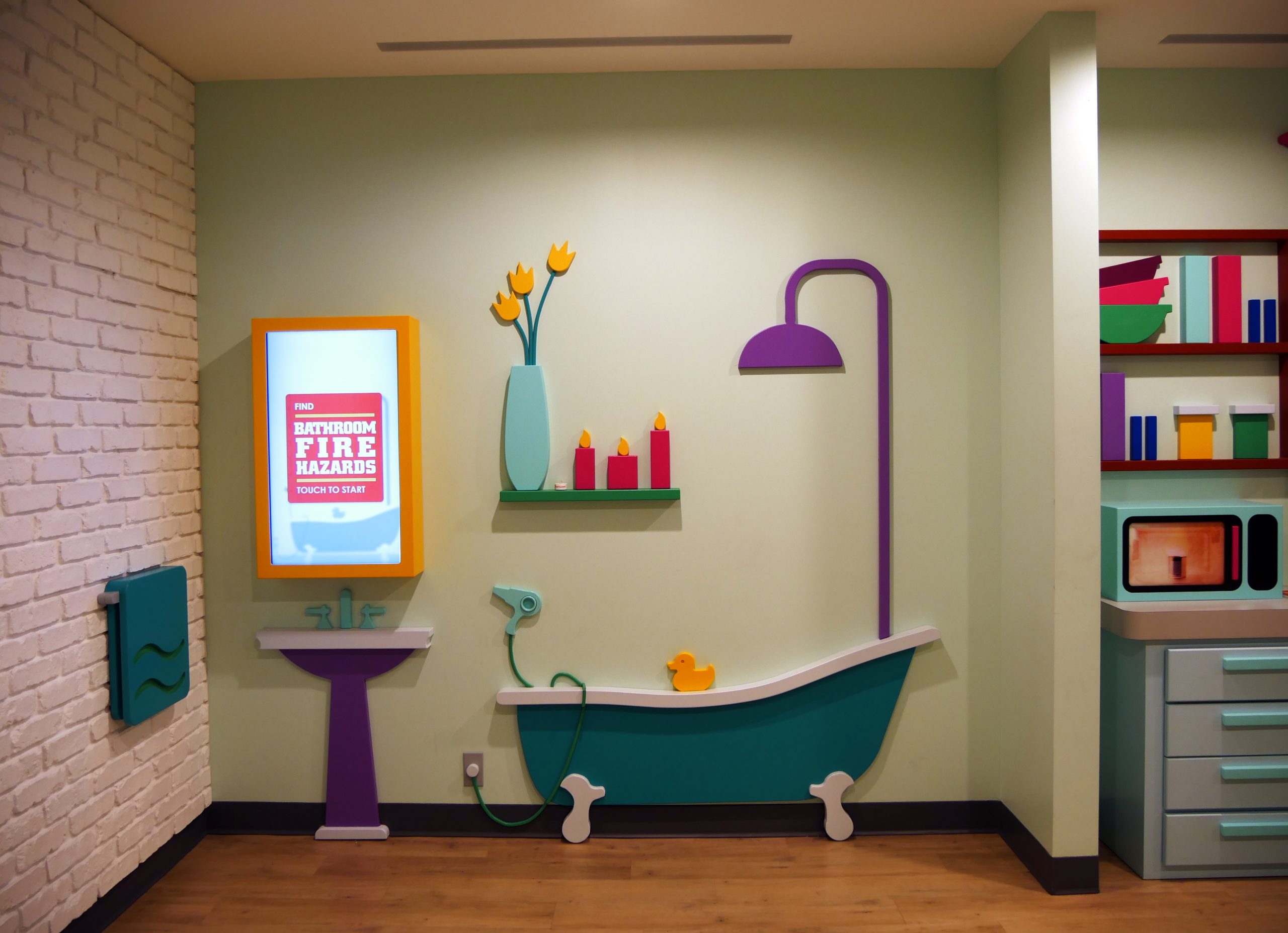Interactive Area featuring bathroom set up with touch screen display above the sink