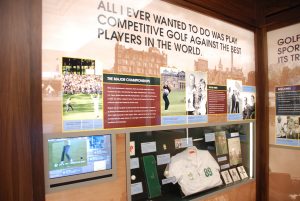 Wall DIsplay with pictures and trophy artifacts about Nicklaus's career
